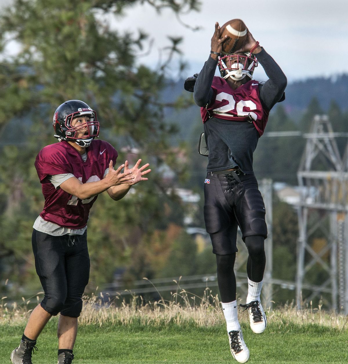 Whitworth’s Jordan Pride picks off a pass in front of Jarin Manuel during practice. (Dan Pelle / The Spokesman-Review)