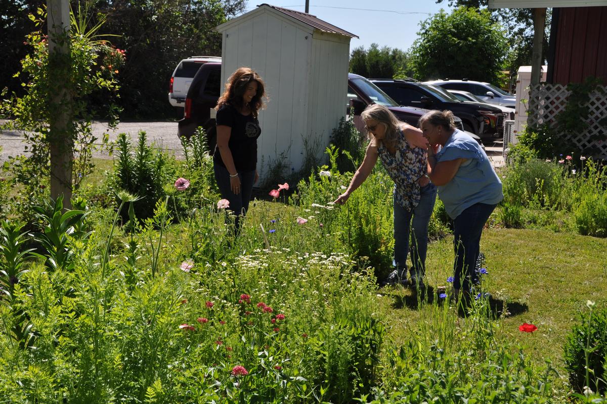 Sowing Joy Farm owner Ondrea Kidd, right, shows off just a few of the flowers found on her farm to Judy Feldner, tour chair (center), and Jill Marfice, president of the Coeur d’Alene Garden Club, in preparation for the club’s 28th annual tour. (Pat Munts/For The Spokesman-Review)
