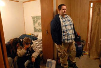 
Dave Lambert, right, stands in a small rental house with James Coltson and Brandee Harding on Tuesday. They all used to live in the tent city on North Napa Street. THE SPOKESMAN-REVIEW
 (JESSE TINSLEY THE SPOKESMAN-REVIEW / The Spokesman-Review)