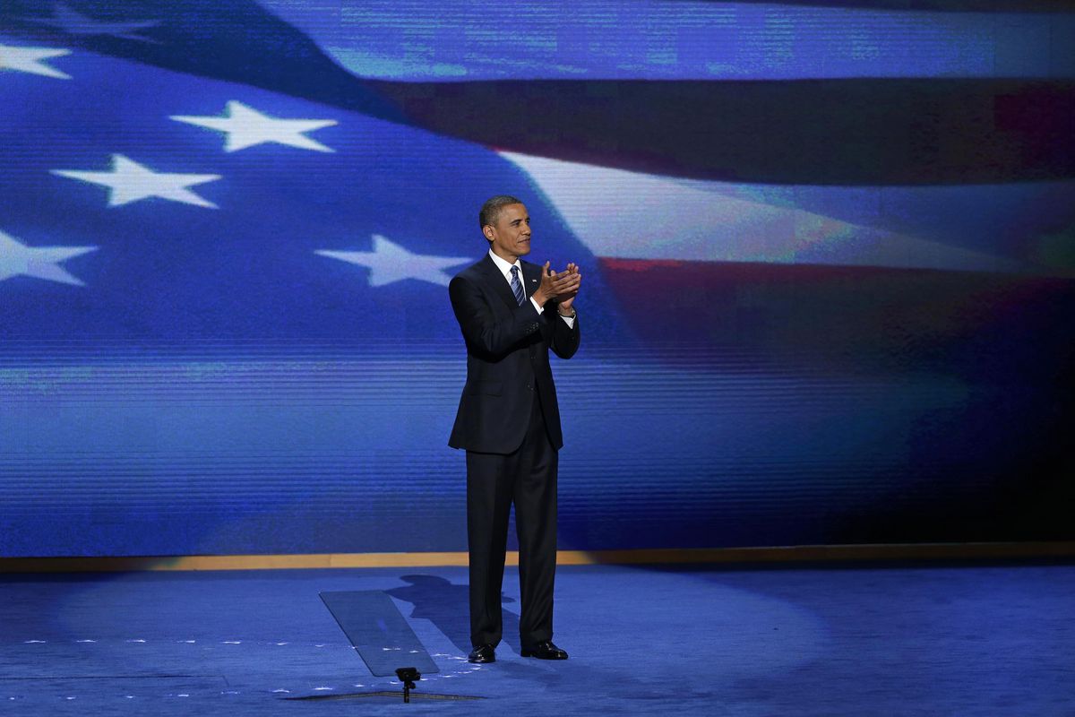 President Barack Obama stands on stage after addressing the Democratic National Convention in Charlotte, N.C., on Thursday, Sept. 6, 2012. (J. Applewhite / Associated Press)