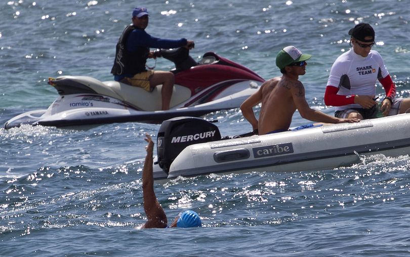 Hoping the third time is a charm: U.S. swimmer Diana Nyad, bottom, begins her swim to Florida from Havana, Cuba, on Saturday. Less than a week before she turns 63 years old, Nyad launched her third bid to set an open-water record by swimming from Havana to the Florida Keys without a protective shark cage. A writer, journalist and motivational speaker, she said she hopes to inspire people of all ages to live active lives. “Instead of staying on the couch for a lifetime and letting this precious time go by, why not be bold?” she said. (Associated Press)