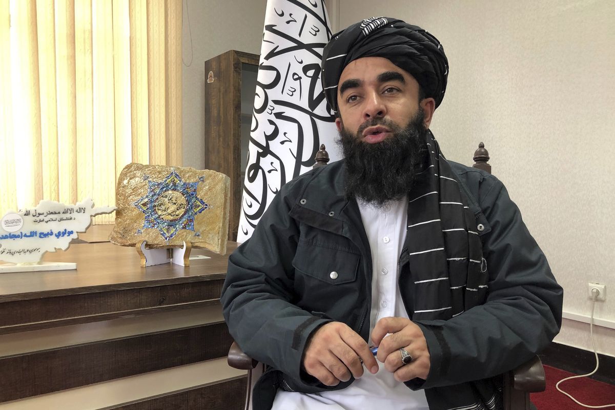 Taliban government spokesman Zabihullah Mujahid speaks during an interview with the Associated Press in Kabul, Afghanistan, Saturday, Jan. 15, 2022. Afghanistan