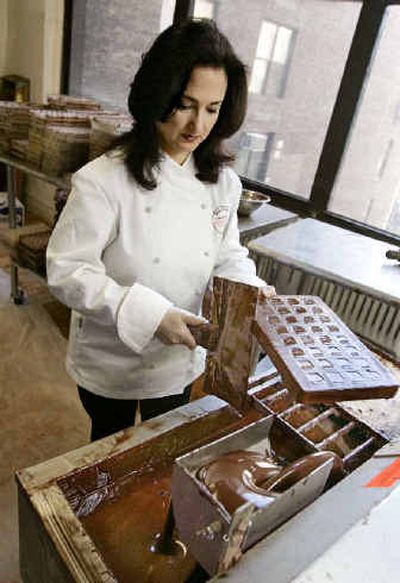 
Joan Coukos, CEO of Chocolat Moderne, was a banker before she switched careers.
 (Associated Press photos / The Spokesman-Review)