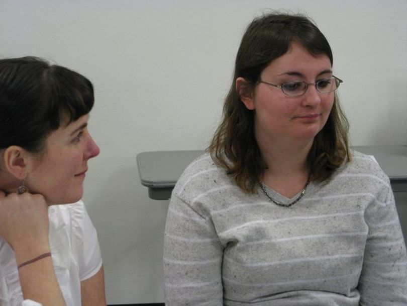 Krystal Esterline, right, who has both developmental disabilities and severe mental illness, talks about the impact of cuts in her Medicaid services on Wednesday; at left is her legal guardian, Nikki Tangen. (Betsy Russell)