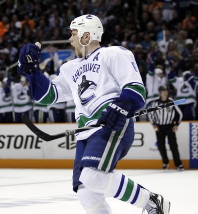 Vancouver Canucks defenseman Sami Salo celebrates his second goal against the San Jose Sharks during the second period. (Associated Press)