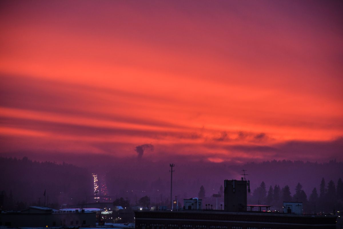 The western sky is ablaze Thursday evening as vehicles travel the Sunset Hill in Spokane, Wash. (Dan Pelle / The Spokesman-Review)