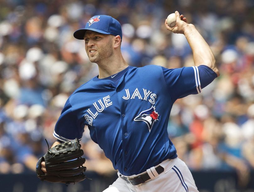 Toronto Blue Jays starting pitcher J.A. Happ throws to a Seattle Mariners batter during the first inning in Toronto on Sunday July 24, 2016. Toronto beat the Mariners 2-0. (Associated Press)