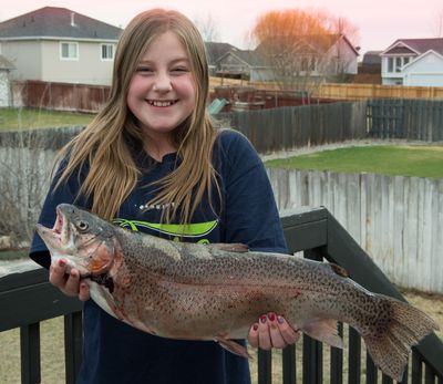 Ruby Ralston was fishing at the Fishing World pools on Sunday, the last day of the Big Horn Outdoor Adventure Show, when she caught this 8-pound, 4-ounce rainbow at Spokane County Fair and Expo Center. (Courtesy)