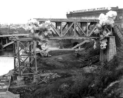 In 1973 the last section of the Union Pacific Railroad trestle was destroyed by explosives. The trestle, which spanned the Spokane River and Monroe Street, was removed as part of the transformation of what is now Riverfront Park, to make way for Expo 74. (Photo Archive)