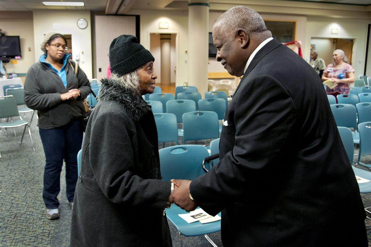 After delivering Martin Luther King Jr.’s “I Have a Dream” speech, the Rev. Percy “Happy” Watkins spends a few moments with Catherine Shines on Tuesday at Providence Holy Family Hospital. Shines attended the gathering with her granddaughter, Cherice Tetzlaff, left. Watkins was a friend of Shines’ husband. (Dan Pelle)