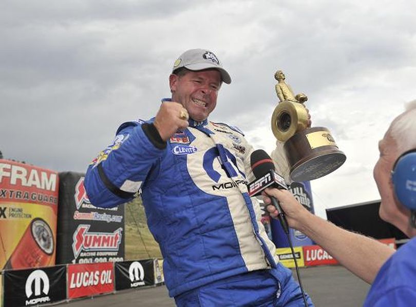 Allen Johnson celebrates his NHRA Full Throttle Drag Racing Series Pro Stock victory at the Mile High Nationals held just outside of Denver, Colorado. (Photo courtesy of NHRA)