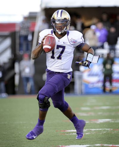 Huskies QB Keith Price will be under a lot of scrutiny. (Associated Press)