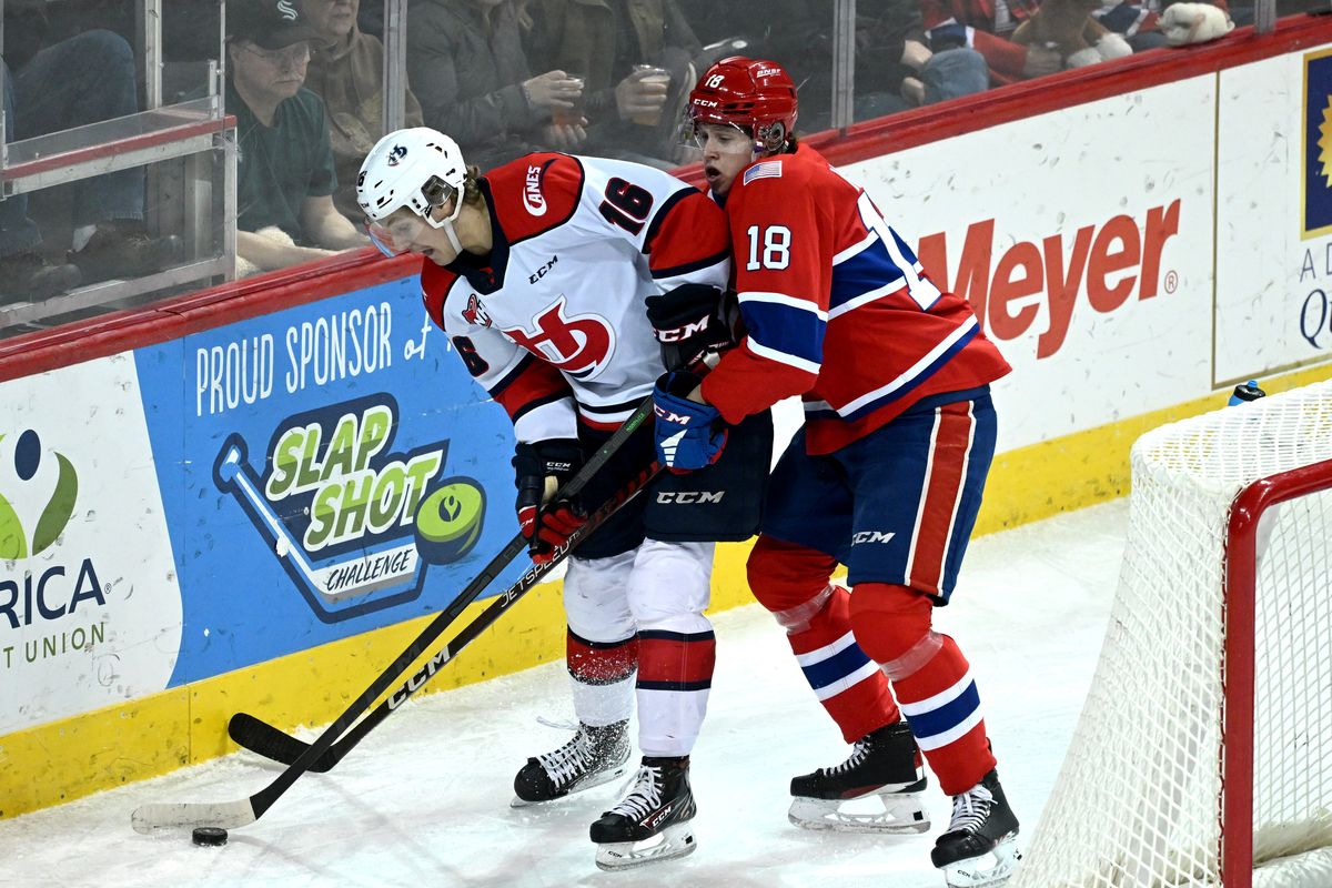 Spokane Chiefs defenseman Will McIsaac, right, competes for control of the puck during a WHL hockey game on Dec. 3, 2022, at the Spokane Arena.  (Colin Mulvany/The Spokesman-Review)
