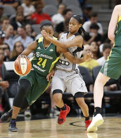 San Antonio’s Moriah Jefferson guards Seattle’s Jewell Loyd, left, during  Friday’s WNBA game in San Antonio. (Ron Cortes / Associated Press)