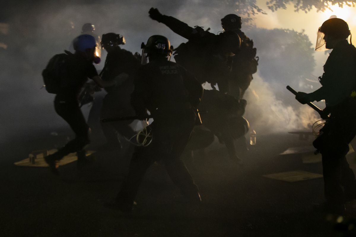 Police declared a riot around midnight as Portland protests continued for the 80th consecutive night Saturday, Aug. 15, 2020. Protesters gathered at Laurelhurst Park Saturday evening before marching to the Penumbra Kelly building.  (Dave Killen)