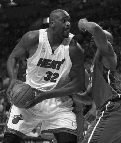 
Miami Heat center Shaquille O'Neal drives against the Detroit Pistons. 
 (Associated Press / The Spokesman-Review)