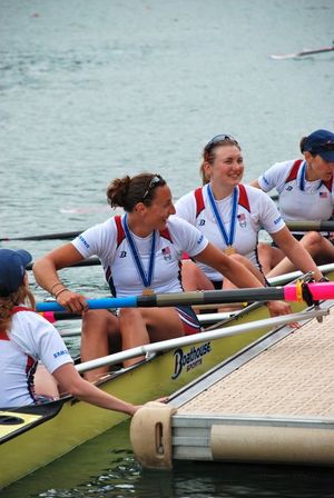 Jamie Redman of Spokane, second from top, sits in her U.S. Rowing Team's Women's 8 boat wearing her gold medal after winning Switzerland's World Cup Regatta on July 10, 2011. (U.S. Rowing)