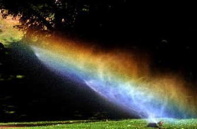 
On a hot day, evaporation can sap sprinkler moisture before it reaches the ground.
 (Brian Plonka / The Spokesman-Review)