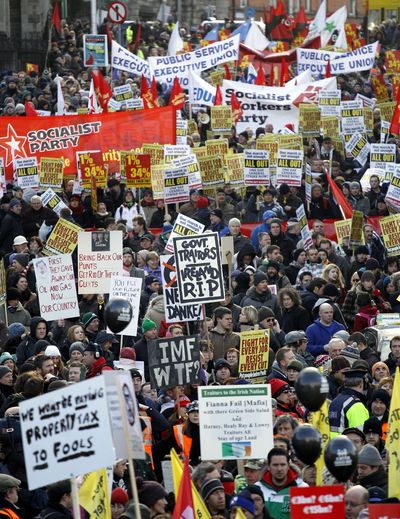 More than 100,000  people march through Dublin, Ireland, on Saturday to protest  the republic’s four-year austerity plan.  (Associated Press)
