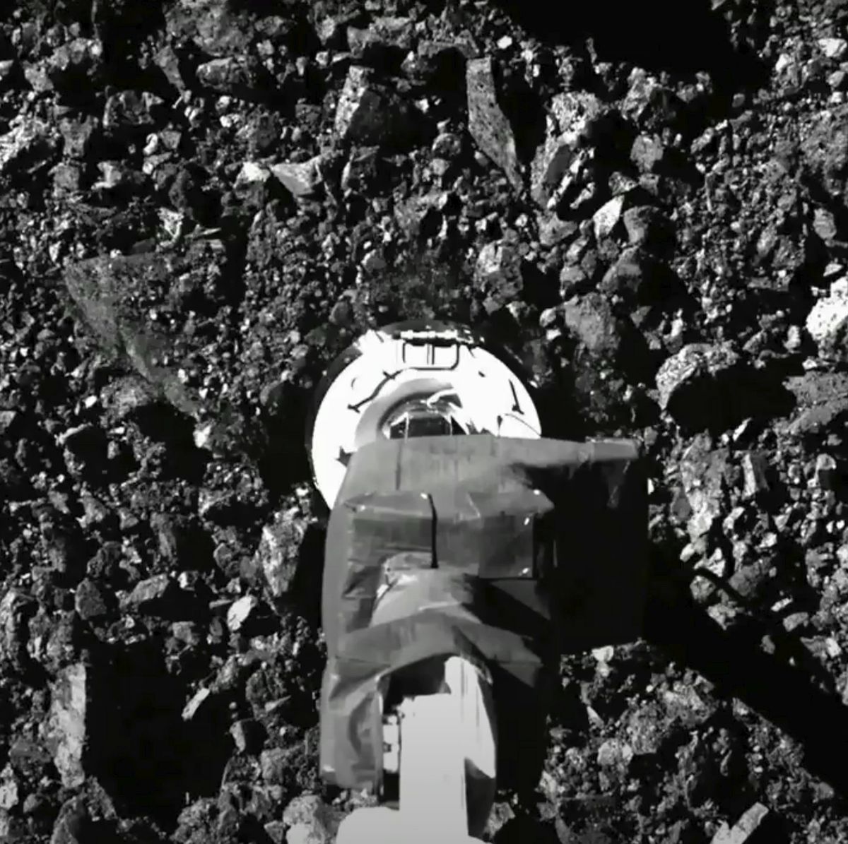 In this image taken from video released by NASA, the Osiris-Rex spacecraft touches the surface of asteroid Bennu on Tuesday, Oct. 20, 2020. (HOGP/Associated Press)