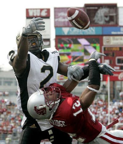 
Washington State cornerback Tyron Brackenridge breaks up a pass intended for Idaho receiver Tariq Ikharo. 
 (Ted S. Warren Associated Press / The Spokesman-Review)