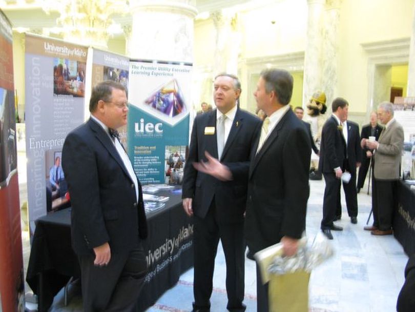 Lt. Gov. Brad Little, right, is among the browsers at University of Idaho displays in the fourth-floor capitol rotunda on Wednesday morning; at center is UI President Duane Nellis. (Betsy Russell)