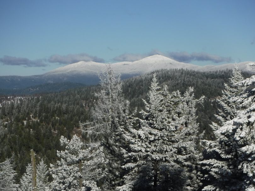 Mount Spokane glistens in the distance north of where hikers stopped to make this photo while enjoying a walk through new snow on Antoine Peak Conservation Area in Spokane Valley. (Holly Weiler)