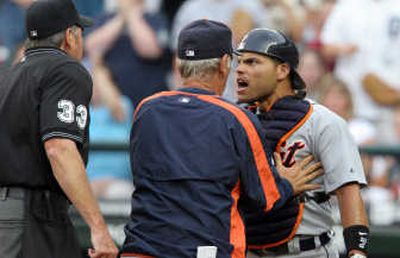 
Detroit manager Jim Leyland, middle, tries to restrain catcher Ivan Rodriguez. Associated Press
 (Associated Press / The Spokesman-Review)