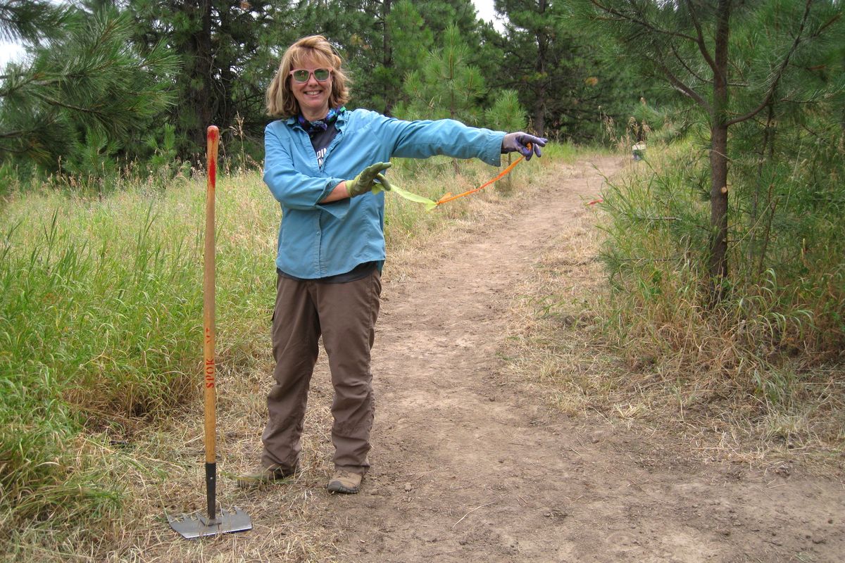 Denise Beardslee, in a physical distancing sort of way, prepares for the ribbon-cutting celebration at the completion of the new Flying L Trail in Glenrose Unit of the Dishman Hills Conservation Area.  (COURTESY OF LYNN SMITH)