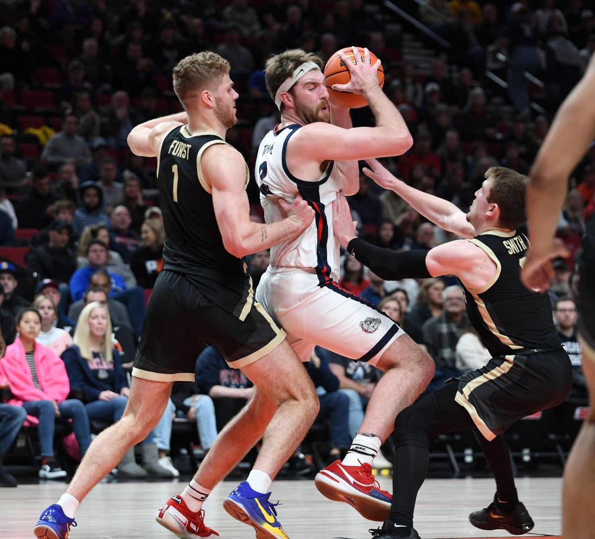 Purdue’s Caleb Furst (1) and Braden Smith double team Gonzaga’s Drew Timme in the paint early in Friday’s Phil Knight Legacy game at the Moda Center in Portland.  (Jesse Tinsley/The Spokesman-Review)
