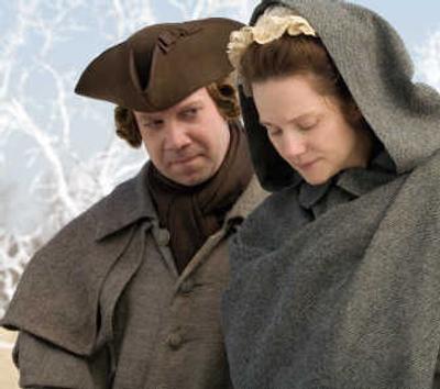 
Paul Giamatti, left, portrays John Adams and Laura Linney plays Abigail Adams in the HBO miniseries, 