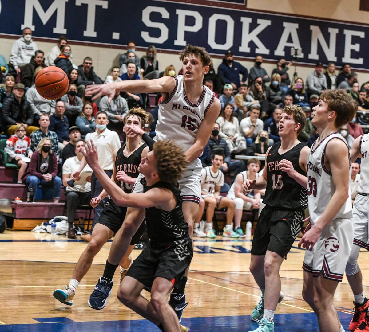 Mt. Spokane forward Maverick Sanders (15) defends the basket against Ferris guard Trayce Atkins, Friday, Jan. 21, 2022 at MSHS.  (Dan Pelle/THE SPOKESMAN-REVIEW)