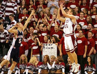 
Santa Clara's Mitch Henke launches a 3-point shot as GU's Derek Raivio defends.
 (Associated Press / The Spokesman-Review)