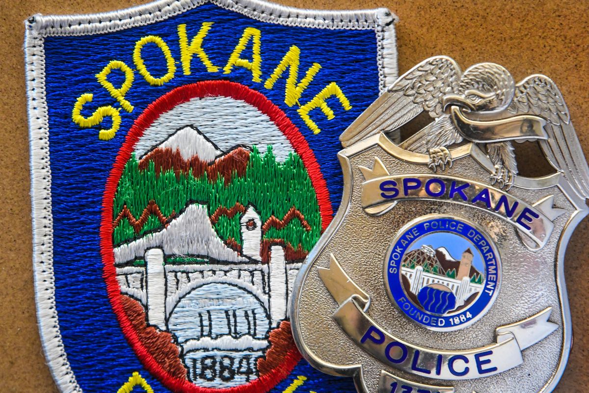 Both the current Spokane Police patch and badge have the 1884 year displayed on the front. New ones will have the corrected 1881. (Dan Pelle / The Spokesman-Review)