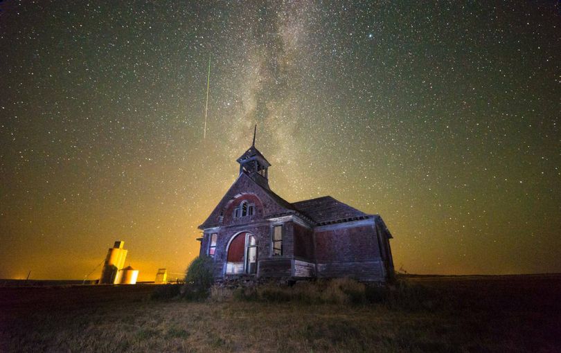Not a Van Gogh painting, but a Perseid Meteor zips through the sky above the old Govan Schoolhouse in Lincoln County. The meteor appears to have a straighter trajectory than the spire on top of the decaying building.