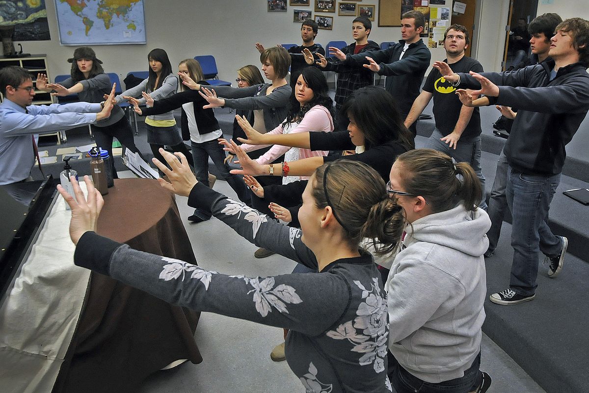 Gonzaga Prep choir director Sean Kane, at the piano, leads the school Jazz Choir through warm-ups and a rehearsal before school  Nov. 20. The choir will perform at the Christmas Bureau at the Spokane County Fair and Expo Center. (CHRISTOPHER ANDERSON)