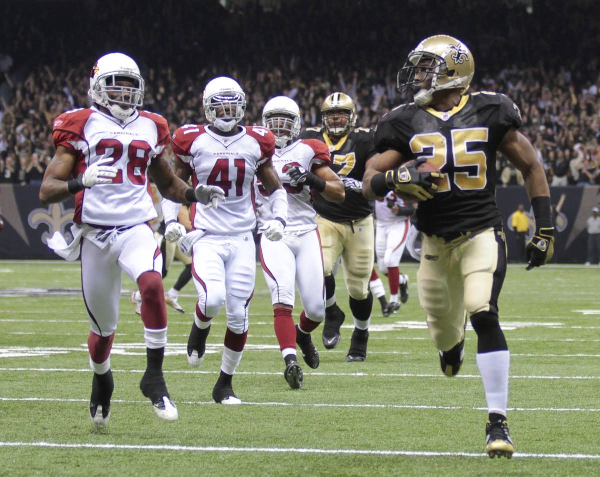 Reggie Bush leaves the Cardinals in his dust during a 46-yard touchdown run in the first quarter.  (Associated Press)