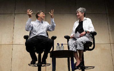 
Microsoft chairman Bill Gates, left, addresses the annual Microsoft Research Faculty Summit as part of the opening plenary session with Maria Klawe, Dean of Engineering at Princeton. 
 (Associated Press / The Spokesman-Review)