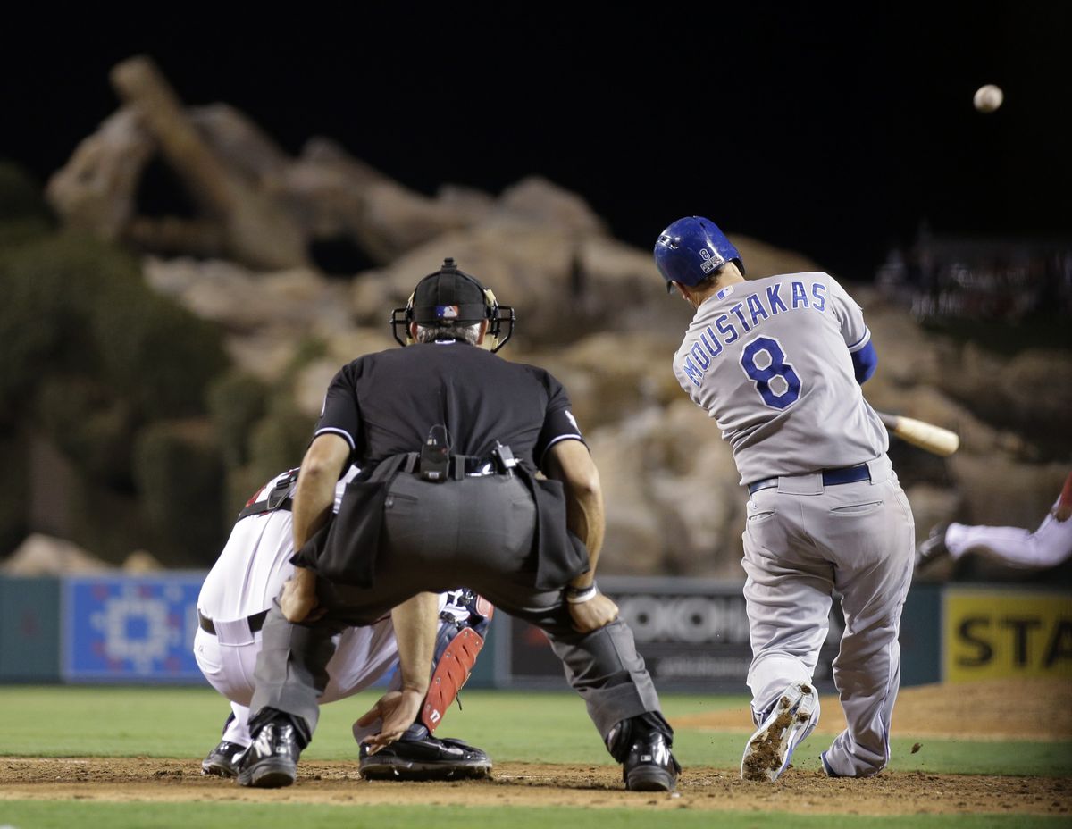 Mike Moustakas homers in the top of the 11th to provide what proved to be the winning run. (Associated Press)