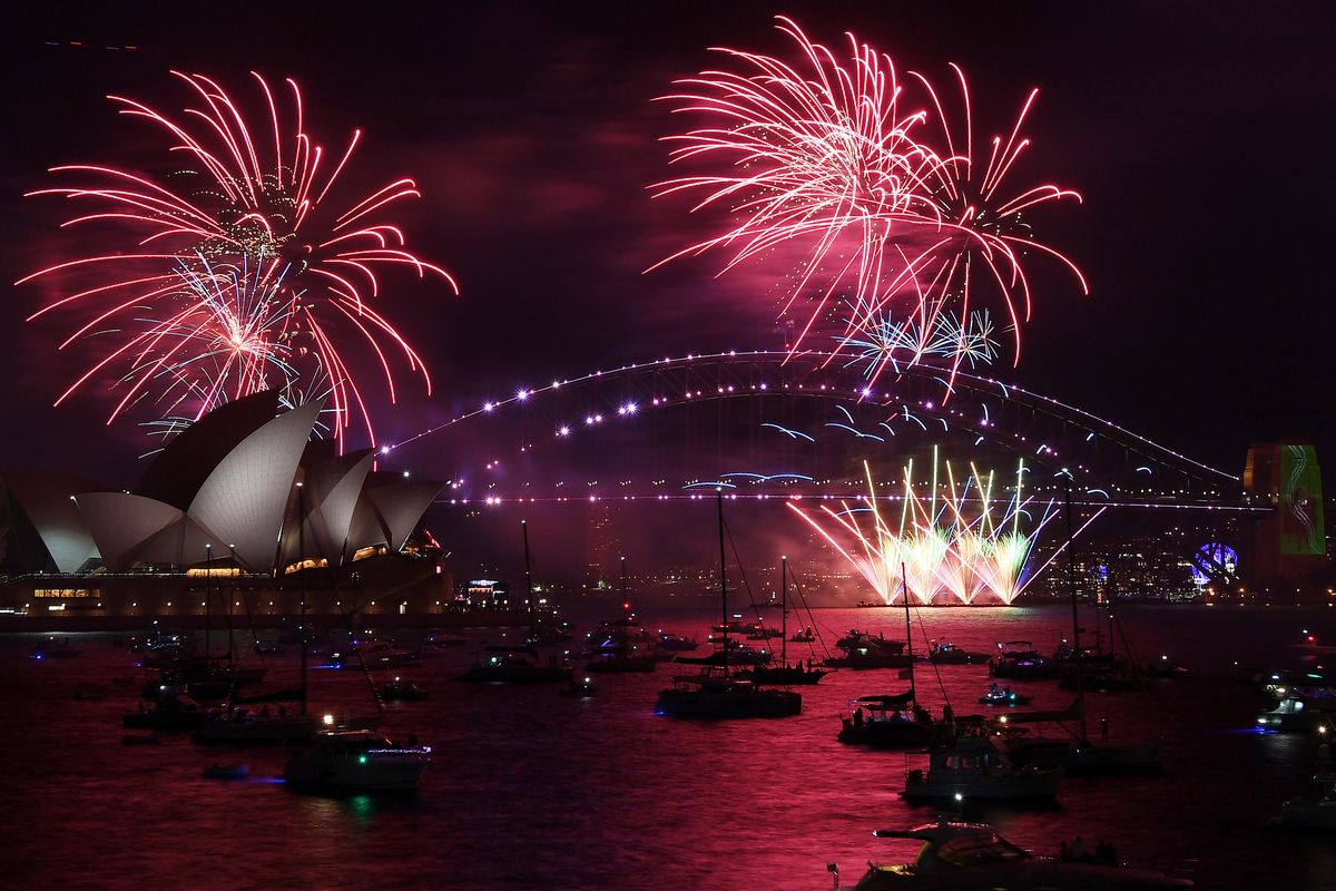 Fireworks explode over the Sydney Opera House and Harbour Bridge as New Year