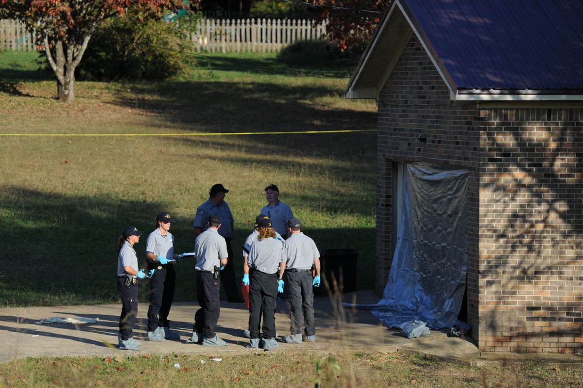 Deputies respond to a call at the home just over the state line in Fayetteville, Tenn., Monday, Oct. 22, 2012. The slayings of three women and a toddler at two homes in southern Tennessee may be related to a body found just across the state line in Alabama, authorities said Tuesday. On Monday, Tennessee officials found three women and an 18-month-old boy dead at two different homes in Lincoln County, about 100 miles south of Nashville. (Sarah Cole / The Huntsville Times)