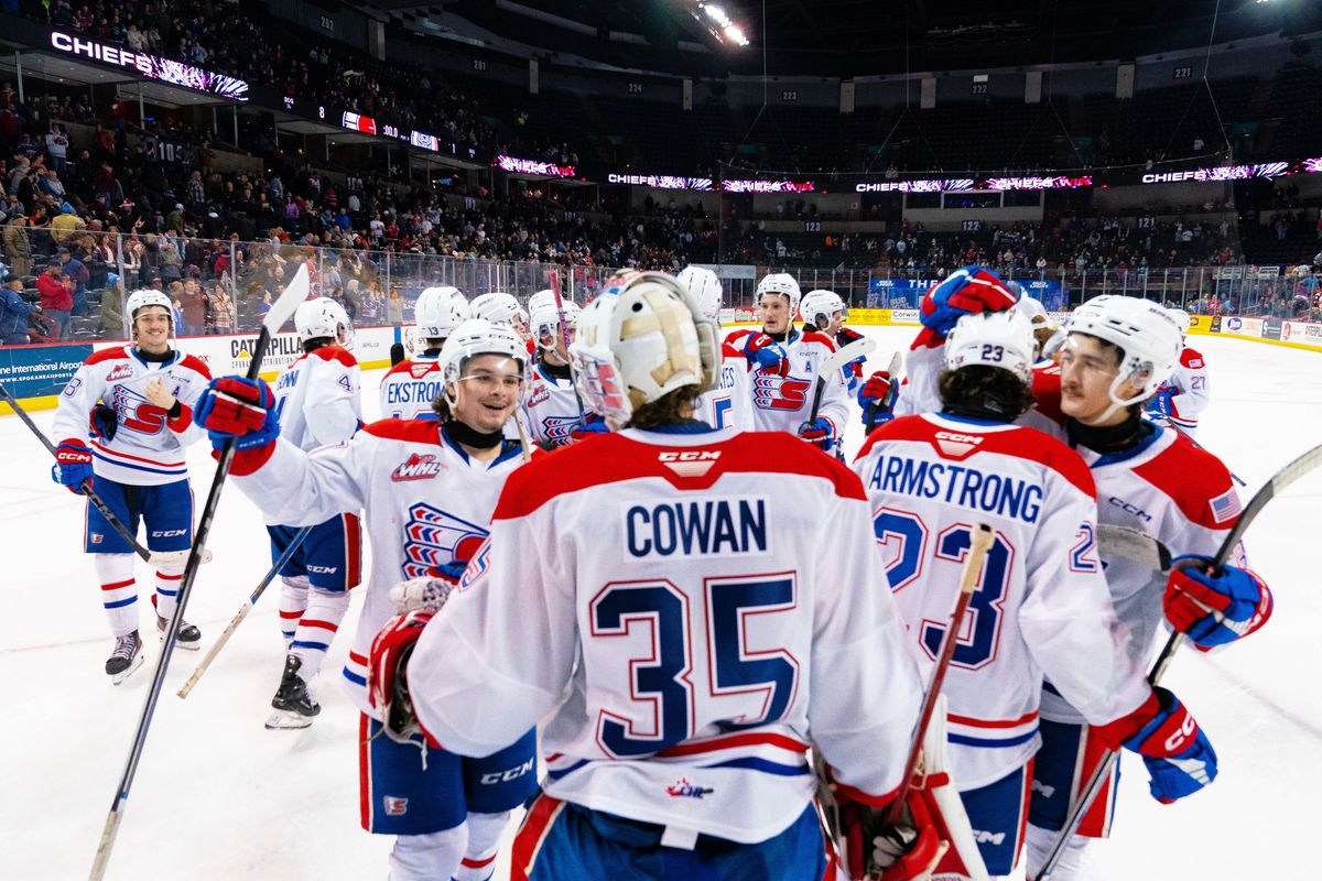 Spokane Chiefs goalie Dawson Cowan is congratulated by teammates after beating the Victoria Royals 8-1 on Saturday, Nov. 25, 2023 at the Spokane Arena.   (Larry Brunt/Spokane Chiefs)
