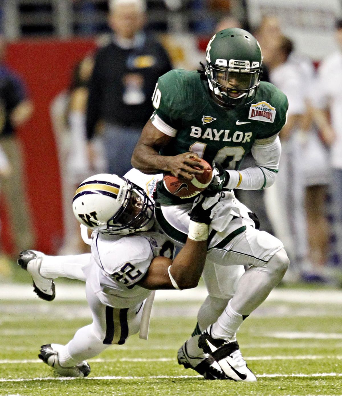 Heisman Trophy-winning QB Robert Griffin III, right, and the Baylor Bears scored nine offensive TDs in Alamo Bowl win.
