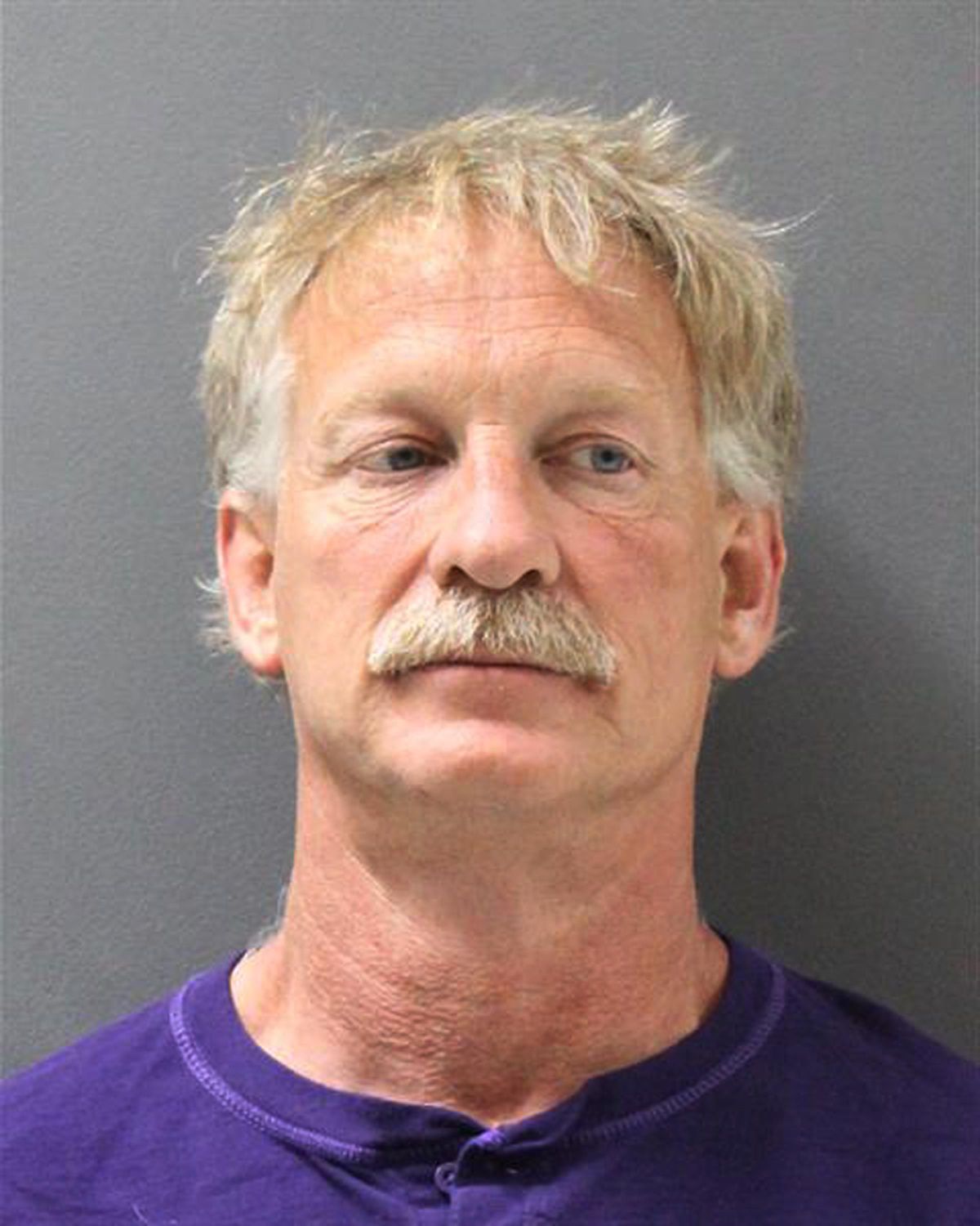 This photo released by the Yavapai County Sheriff’s Office shows suspect Gene Alan Carpenter, 54,  of Prescott Valley, Ariz., Carpenter, who is accused of flying a drone over a major Arizona wildfire, has been arrested, with authorities saying he interrupted firefighting efforts on a blaze that has forced thousands of people from their homes. The Yavapai County Sheriff’s Office said Saturday, July 1, 2017, that Carpenter  was in custody on charges of endangerment and unlawful operation of an unmanned aircraft. (Uncredited / Yavapai County Sheriff’s Office)
