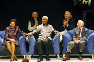 
Former South African President Nelson Mandela, flanked from left, by his wife Graca Machel, British singer Peter Gabriel, British entrepreneur Richard Branson and former U.S. President Jimmy Carter, in Johannesburg Wednesday. Associated Press
 (Associated Press / The Spokesman-Review)