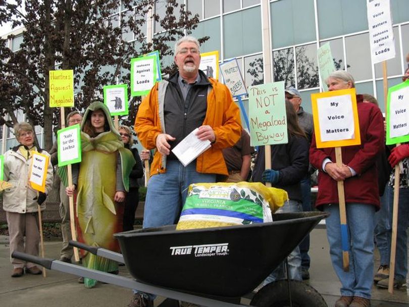 Bill Sedivy, executive director of Idaho Rivers United, speaks at a small protest as Idaho river advocates deliver 50 pounds of peanuts to ITD motor vehicles administrator Alan Frew on Friday, protesting Frew's testimony this week that 