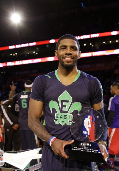 Kyrie Irving holds his MVP trophy after leading the East All-Stars past the West All-Stars on Sunday in New Orleans. (Gerald Herbert / Associated Press)