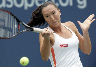
Jelena Jankovic, of Serbia, makes a return to Elena Dementieva, of Russia, at the U.S. Open in New York. 
 (Associated Press / The Spokesman-Review)