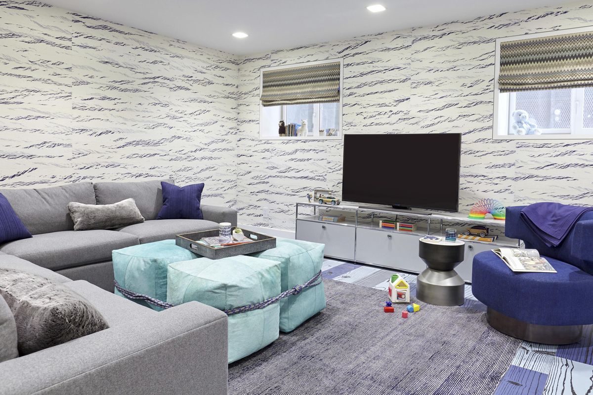 This undated photo provided by Jenny Kirschner shows a basement designed by the New York-based interior designer. Cheerful color and cozy furnishings with warm, soft upholstery transform this basement designed into an inviting and family-friendly space. (Ryan Dausch / AP)