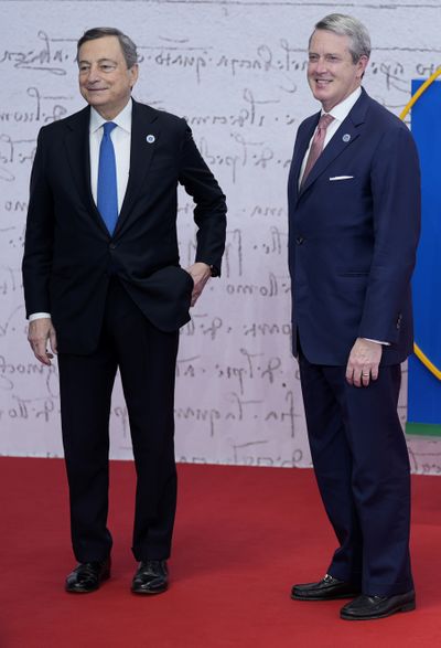 Chair of the Financial Stability Board, US Randal Quarles, right, is greeted by Italy’s Prime Minister Mario Draghi during arrivals at the La Nuvola conference center for the G20 summit in Rome, Saturday, Oct. 30, 2021. The two-day Group of 20 summit is the first in-person gathering of leaders of the world’s biggest economies since the COVID-19 pandemic started.  (Domenico Stinellis)